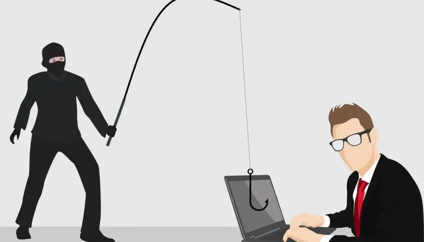 Un pirate informatique tente une usurpation d'identité par téléphone, utilisant une canne à pêche pour attraper un ordinateur portable.
